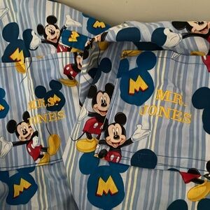 Calling Mr. & Mrs. Jones. Disney Mickey matching aprons.